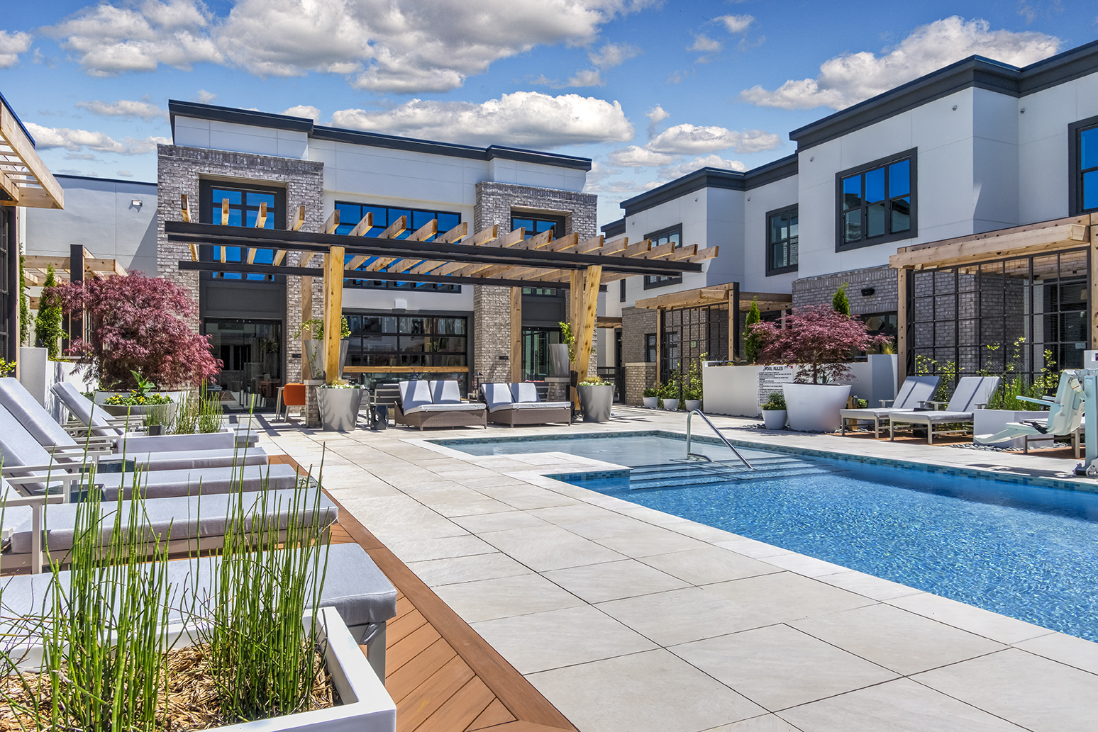 Hazel SouthPark central courtyard with pool surrounded by apartments and townes