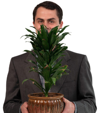 Daniel Richard with a plant