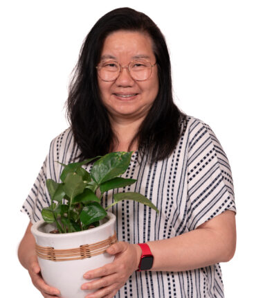 Fang Zhou with a plant